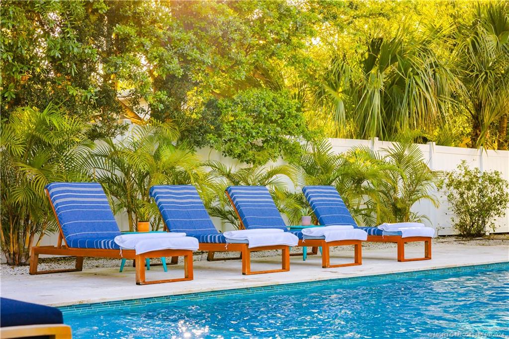 3713 Southeast Matanzas Street Stuart, FL 34996 - Photo 9 of 53 a backyard of a house with outdoor seating