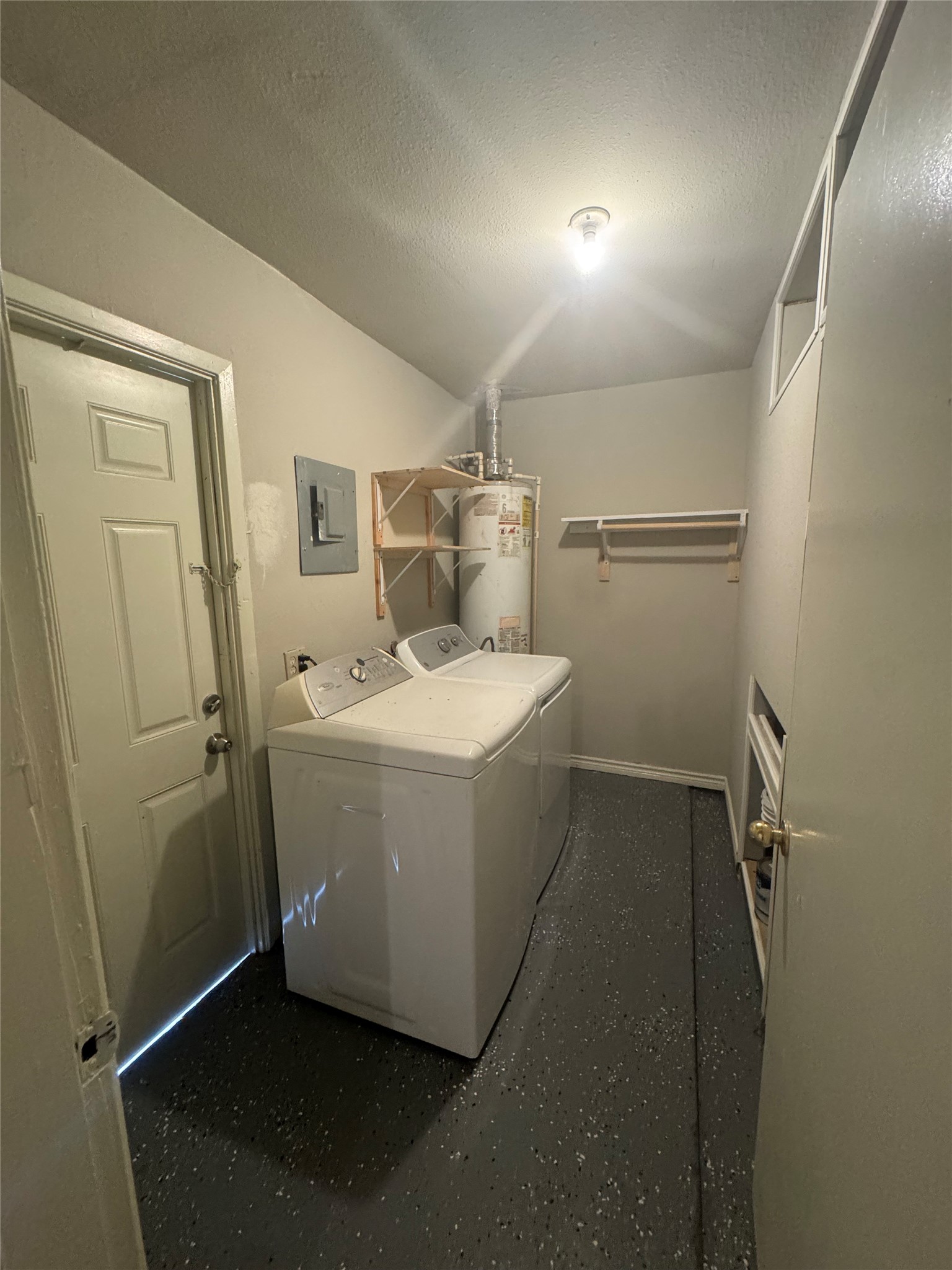 1443 Willow Rock Road Houston, TX 77088 - Photo 26 of 27 a utility room with a washer and dryer