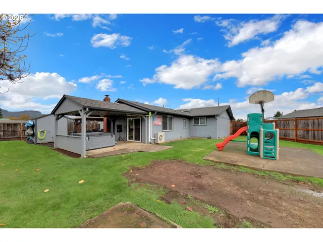 a childrens park with lots of swings and slides