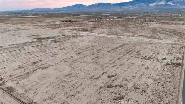 a view of lawn chairs and mountain view