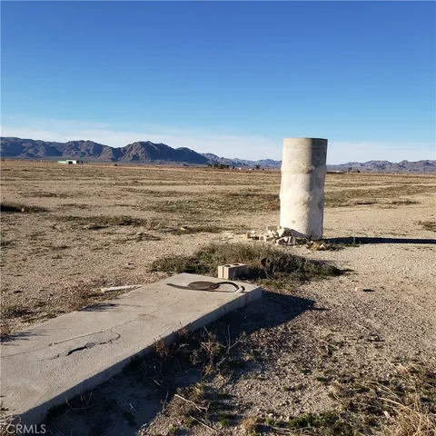 a view of a ocean with a mountain