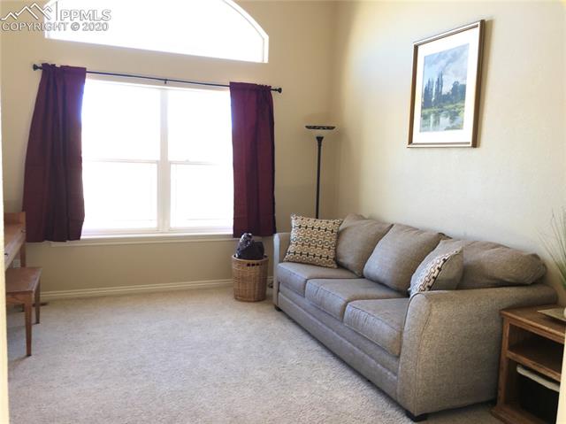 9275 Rockingham Drive Peyton, CO 80831 - Photo 5 of 26 Formal Living Room with Arched Window.