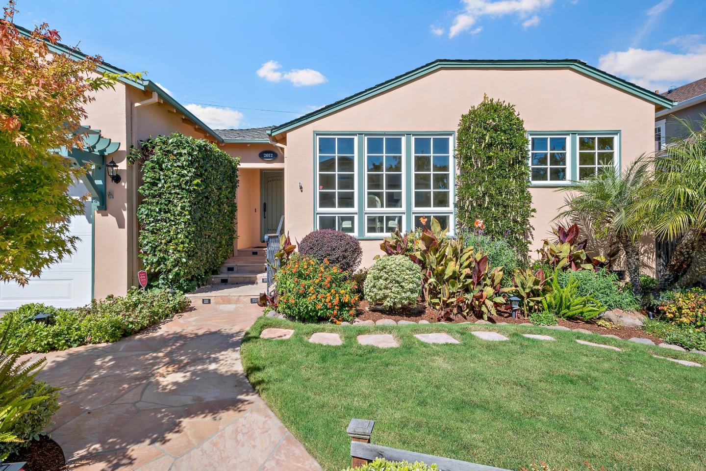 2012 Davis Drive Burlingame, CA 94010 - Photo 3 of 34 a front view of a house with a garden