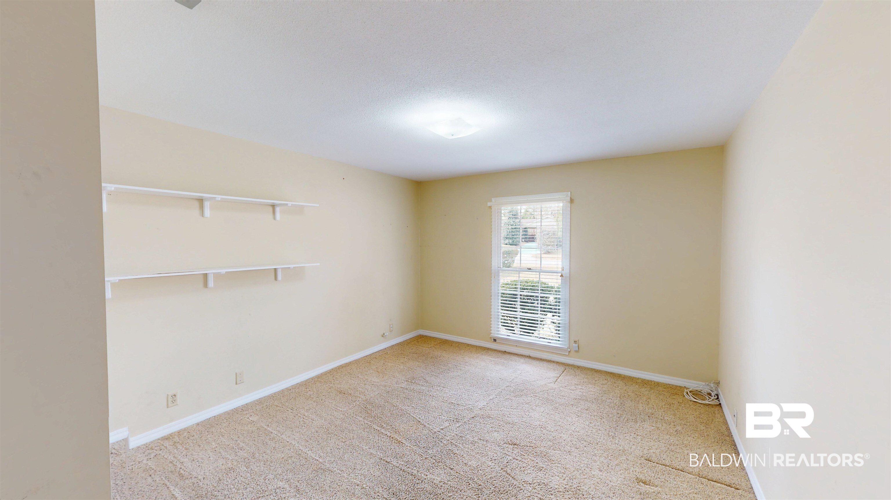 609 Burlington Court Mobile, AL 36608 - Photo 16 of 19 Empty room featuring light colored carpet and baseboards