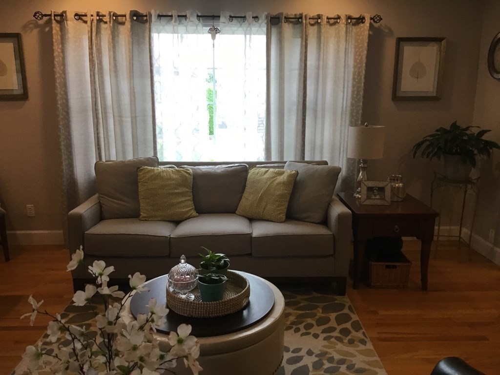 94 Winthrop Street Fall River, MA 02721 - Photo 12 of 29 a living room with furniture and a window
