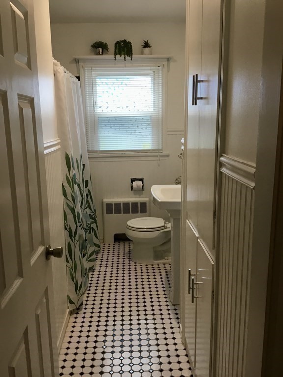 94 Winthrop Street Fall River, MA 02721 - Photo 14 of 29 a bathroom with a sink a toilet a window and shower