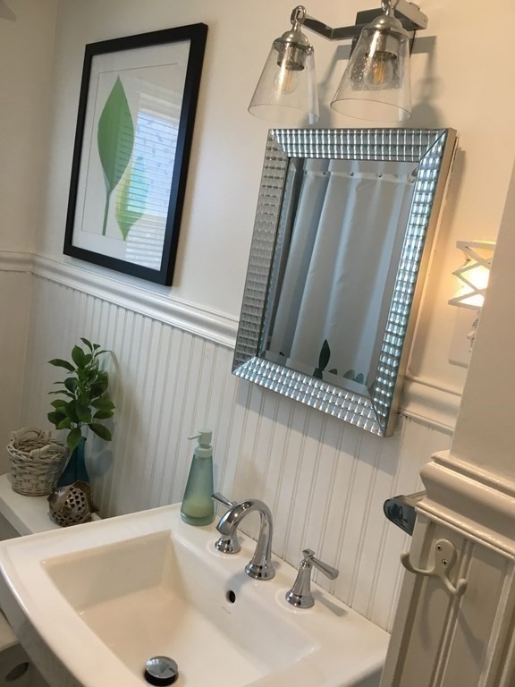 94 Winthrop Street Fall River, MA 02721 - Photo 15 of 29 a bathroom with a sink and a mirror