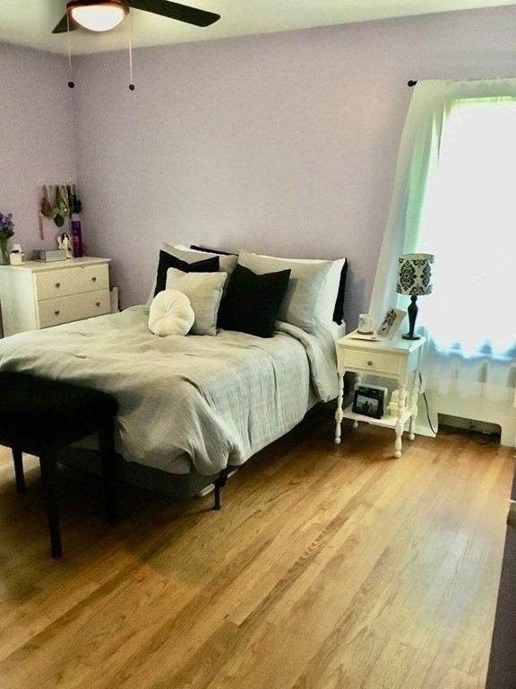 94 Winthrop Street Fall River, MA 02721 - Photo 16 of 29 a bedroom with a bed and a chair