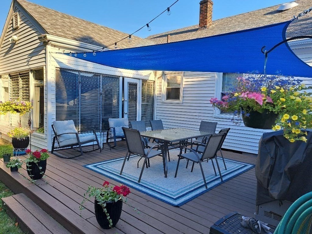 94 Winthrop Street Fall River, MA 02721 - Photo 3 of 29 a view of a patio with table and chairs and potted plants