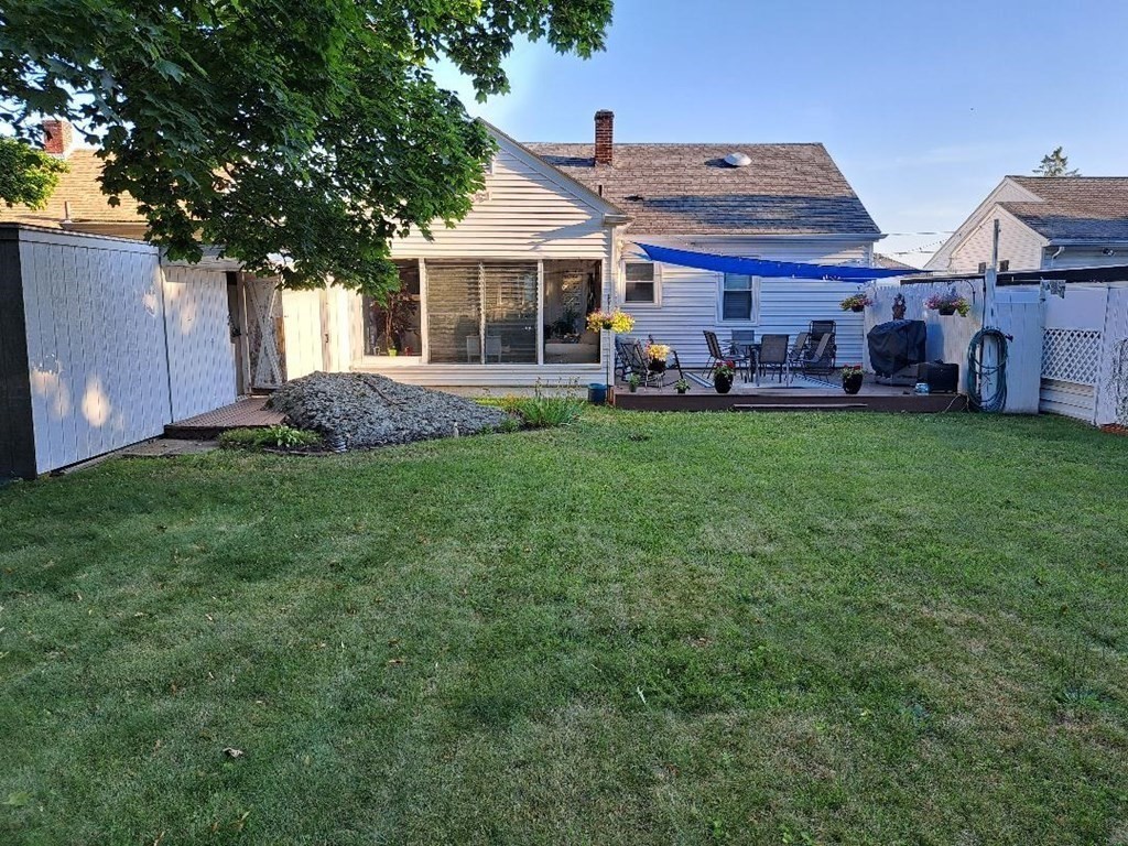 94 Winthrop Street Fall River, MA 02721 - Photo 4 of 29 a front view of a house with a garden