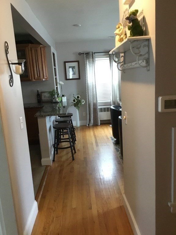 94 Winthrop Street Fall River, MA 02721 - Photo 8 of 29 a living room with furniture and a wooden floor