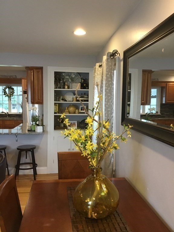 94 Winthrop Street Fall River, MA 02721 - Photo 10 of 29 a vase of flowers sitting on a table with window