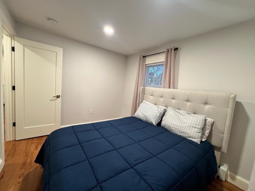 81 Stuart Street Gardner, MA 01440 - Photo 11 of 24 a bedroom with a bed and window