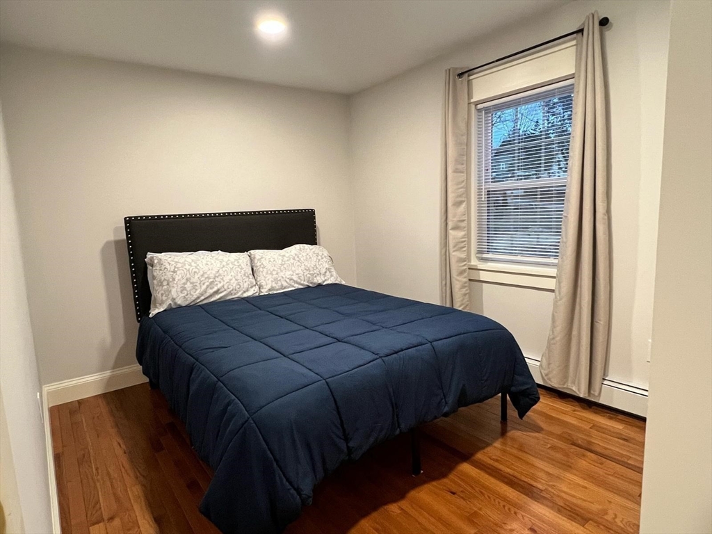 81 Stuart Street Gardner, MA 01440 - Photo 12 of 24 a bedroom with a bed and window