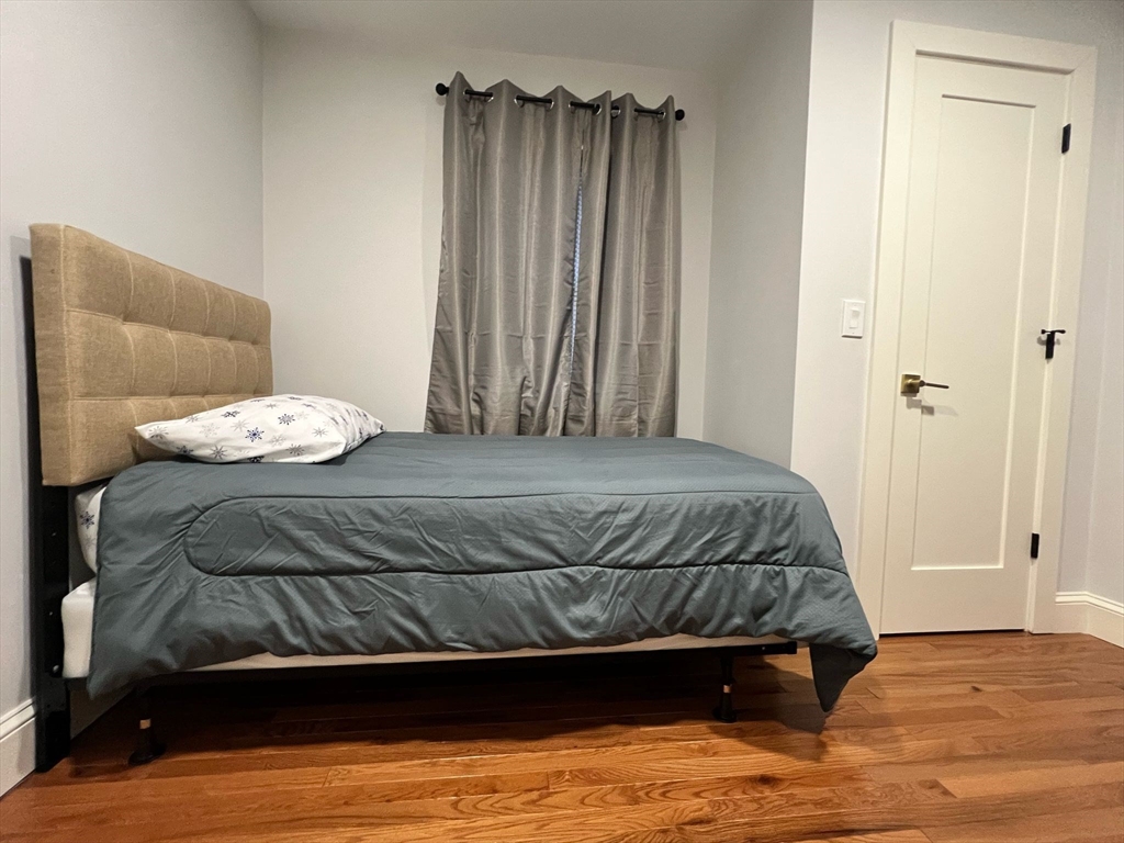 81 Stuart Street Gardner, MA 01440 - Photo 14 of 24 a bedroom with a bed and a window