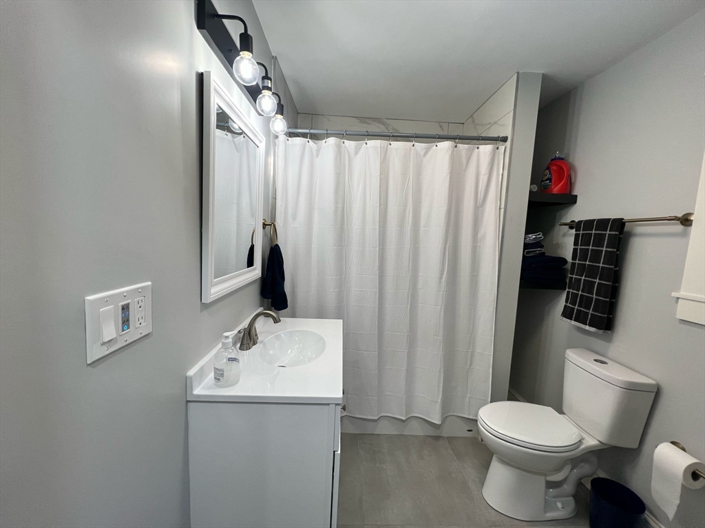 81 Stuart Street Gardner, MA 01440 - Photo 17 of 24 a bathroom with a sink toilet and shower