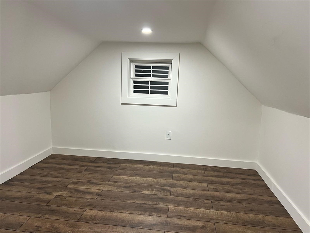 81 Stuart Street Gardner, MA 01440 - Photo 20 of 24 a view of an empty room with wooden floor and a window