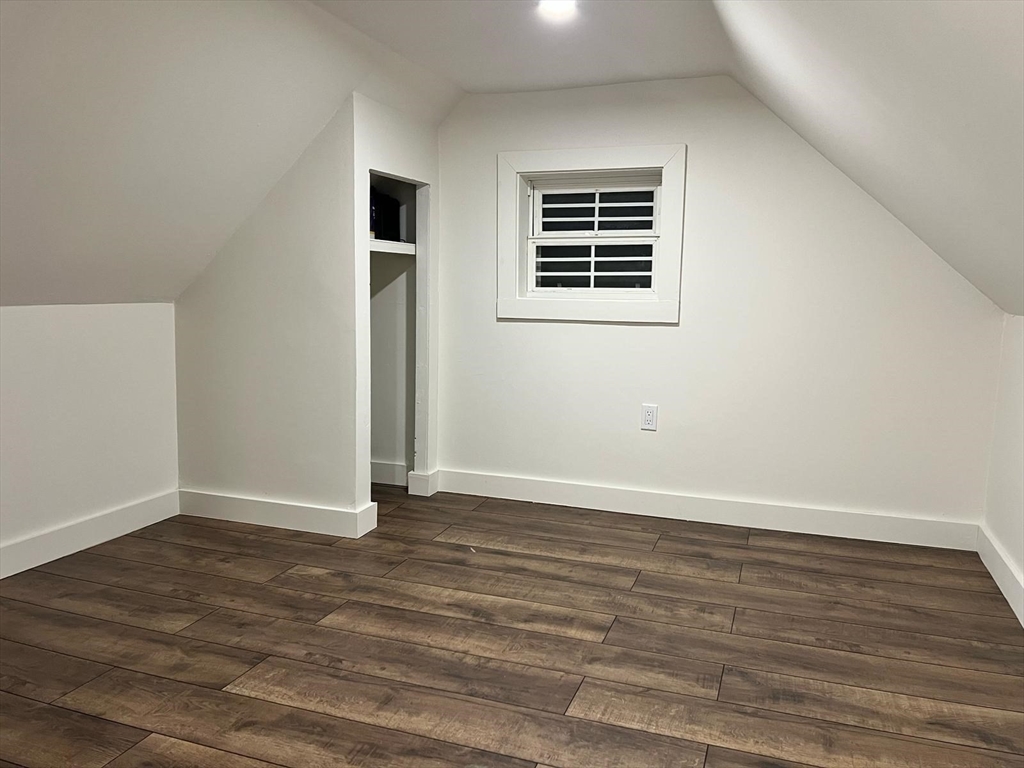 81 Stuart Street Gardner, MA 01440 - Photo 21 of 24 an empty room with wooden floor and windows