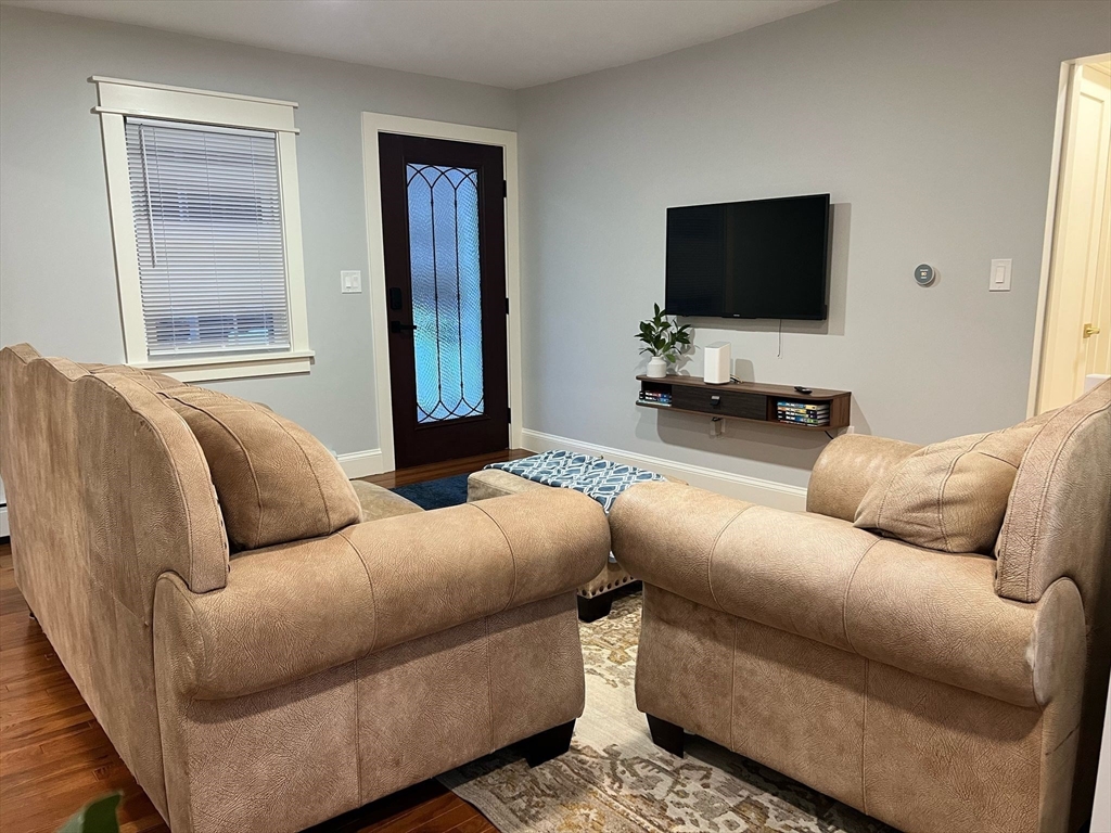 81 Stuart Street Gardner, MA 01440 - Photo 7 of 24 a living room with furniture and a flat screen tv