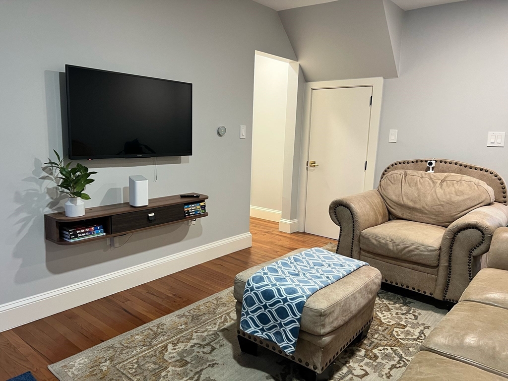 81 Stuart Street Gardner, MA 01440 - Photo 8 of 24 a living room with furniture and a flat screen tv