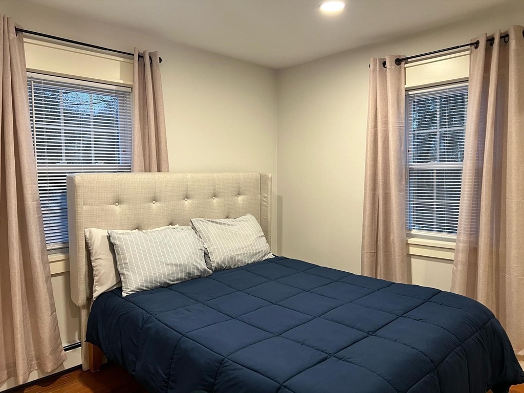 81 Stuart Street Gardner, MA 01440 - Photo 10 of 24 a bedroom with a bed and next to a window