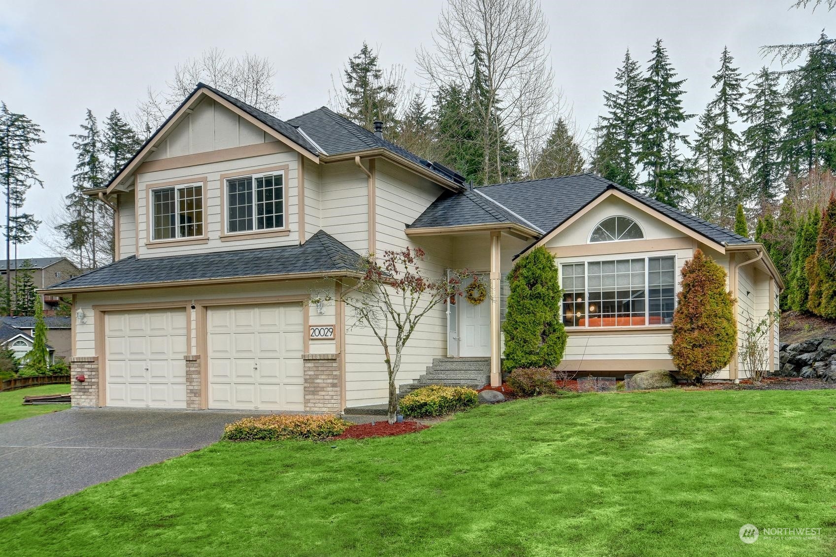 20029 34th Avenue Southeast Bothell, WA 98012 - Photo 1 of 22 a front view of house with yard and green space