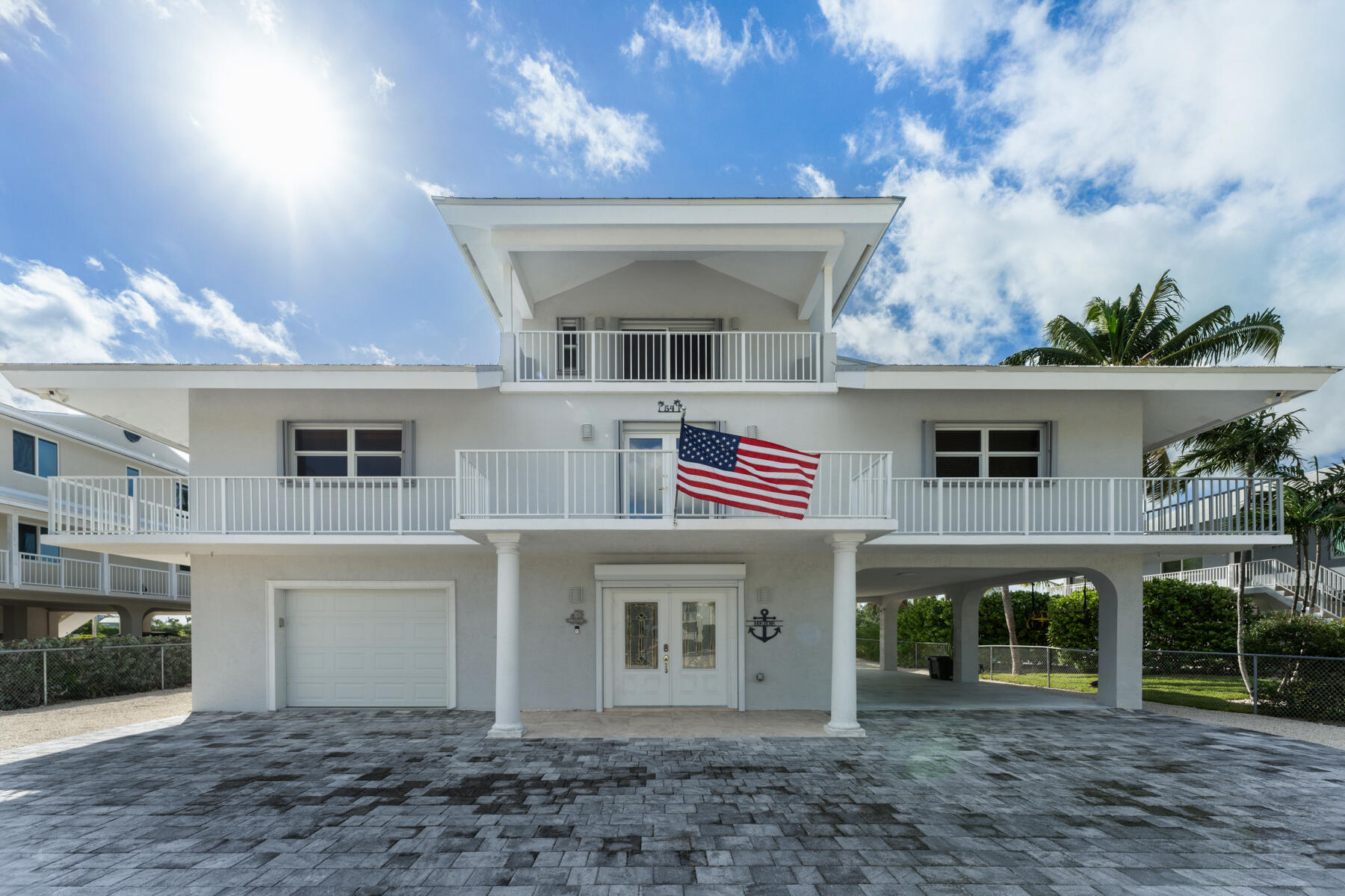 54 Mutiny Place Key Largo, FL 33037 - Photo 12 of 69 Garage and lake home across from Bay