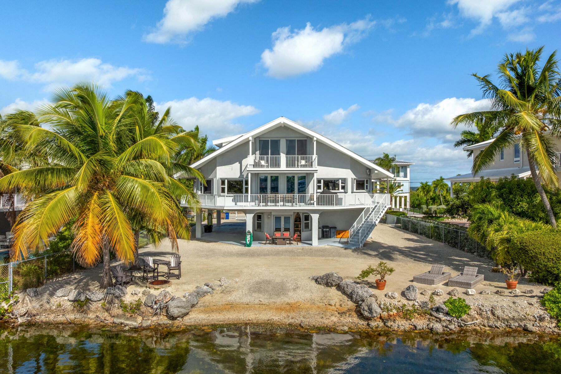 54 Mutiny Place Key Largo, FL 33037 - Photo 69 of 69 Framed by beautiful palm trees