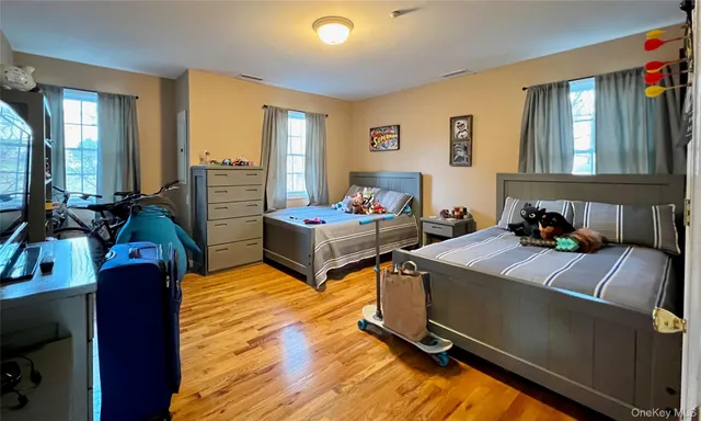 a bedroom with furniture and a window