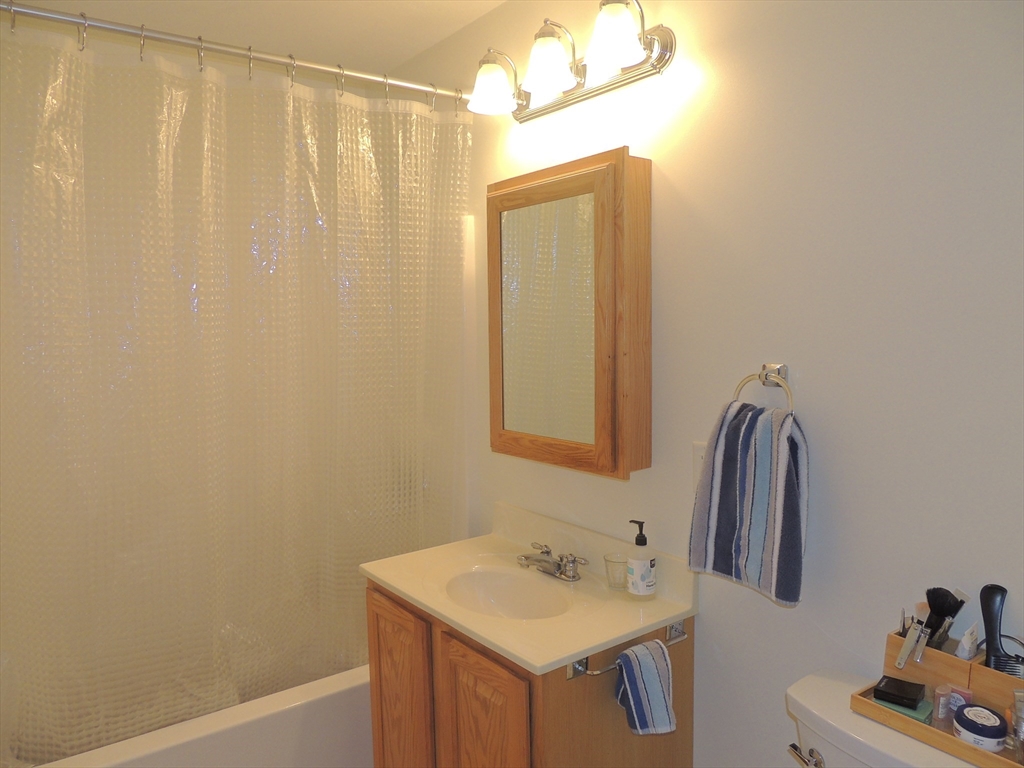 26 Greenleaves Drive, Unit 635 Amherst, MA 01002 - Photo 11 of 11 a bathroom with a sink and a mirror