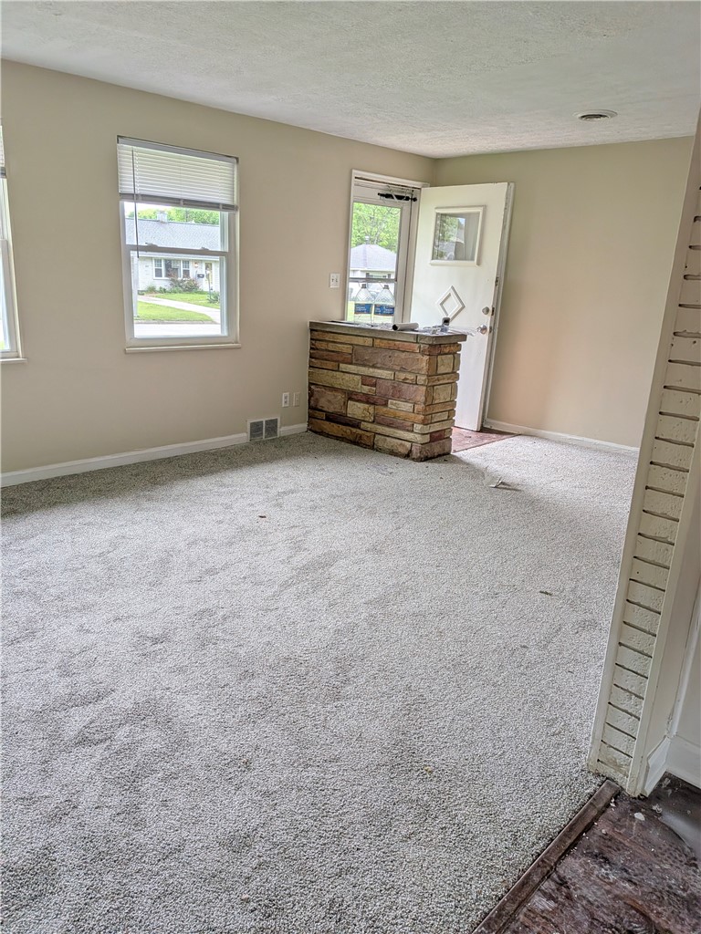 840 Brookfield Road Kettering, OH 45429 - Photo 9 of 13 This bright living area features new flooring, creating a welcoming and comfortable atmosphere.