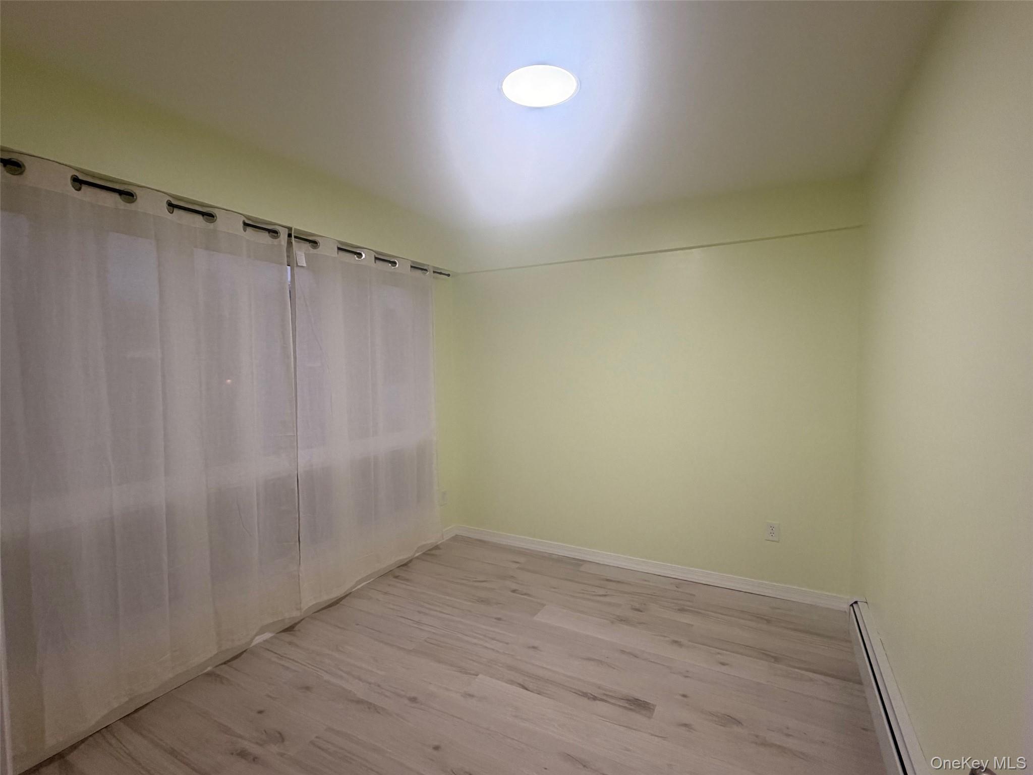 79 Monhagen Avenue Middletown, NY 10940 - Photo 11 of 22 a view of a room with wooden floor