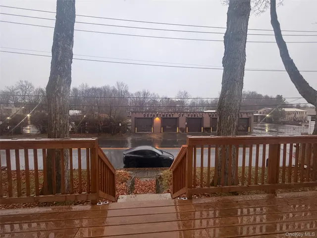 a view of a balcony with yard