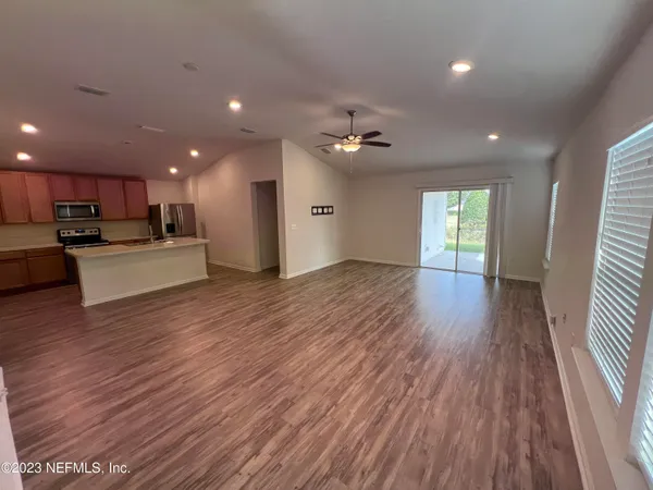a view of kitchen with sink and wooden floor