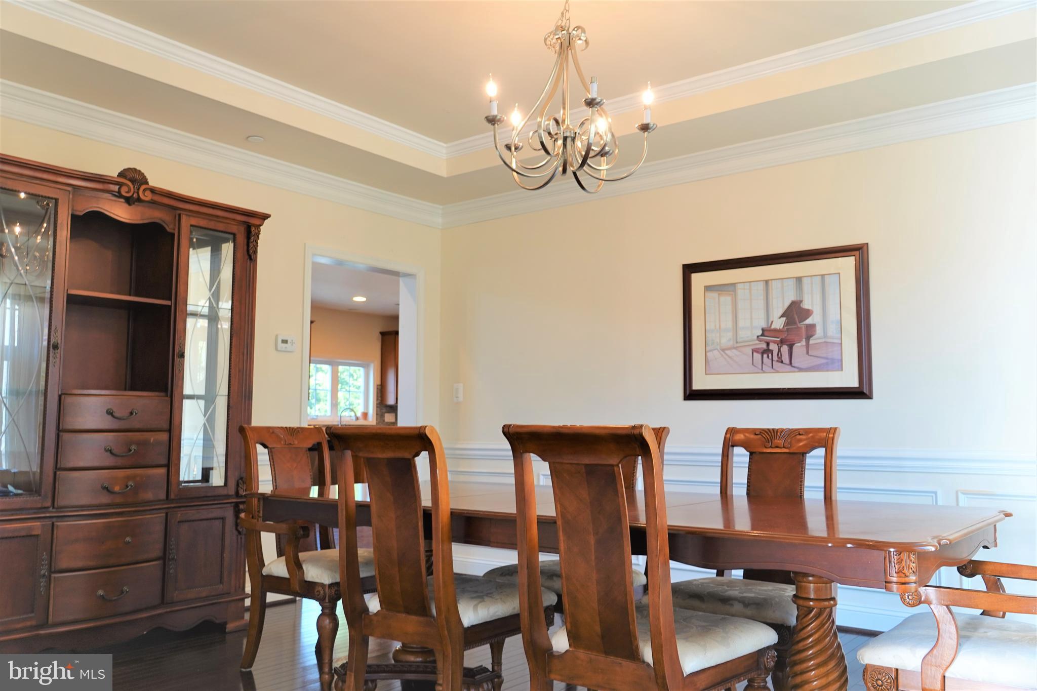 6606 Pyle Road Bethesda, MD 20817 - Photo 11 of 29 a view of a dining room with furniture and chandelier