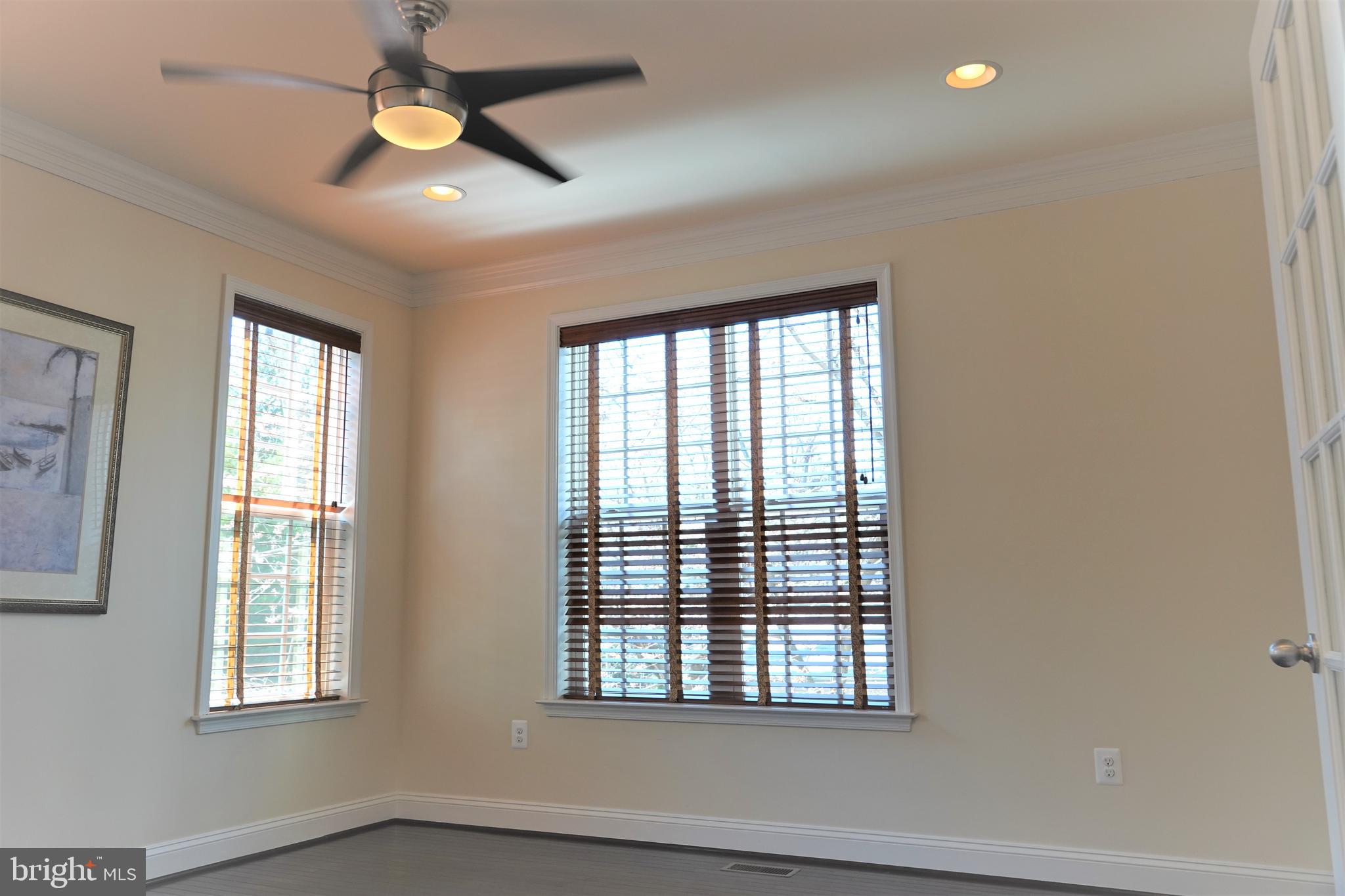 6606 Pyle Road Bethesda, MD 20817 - Photo 12 of 29 a view of an empty room with a window and a ceiling fan