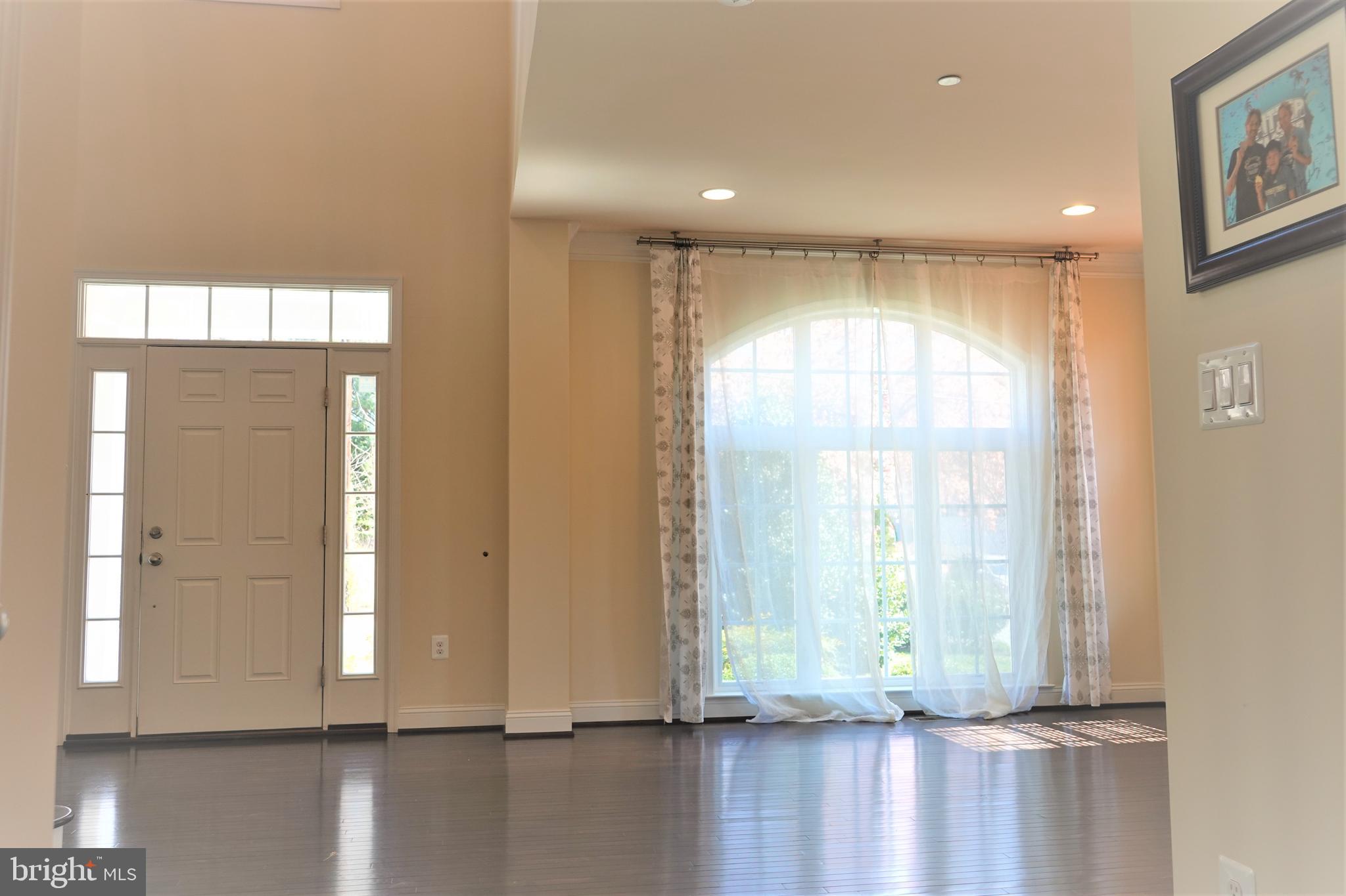 6606 Pyle Road Bethesda, MD 20817 - Photo 13 of 29 a view of empty room with wooden floor and fan