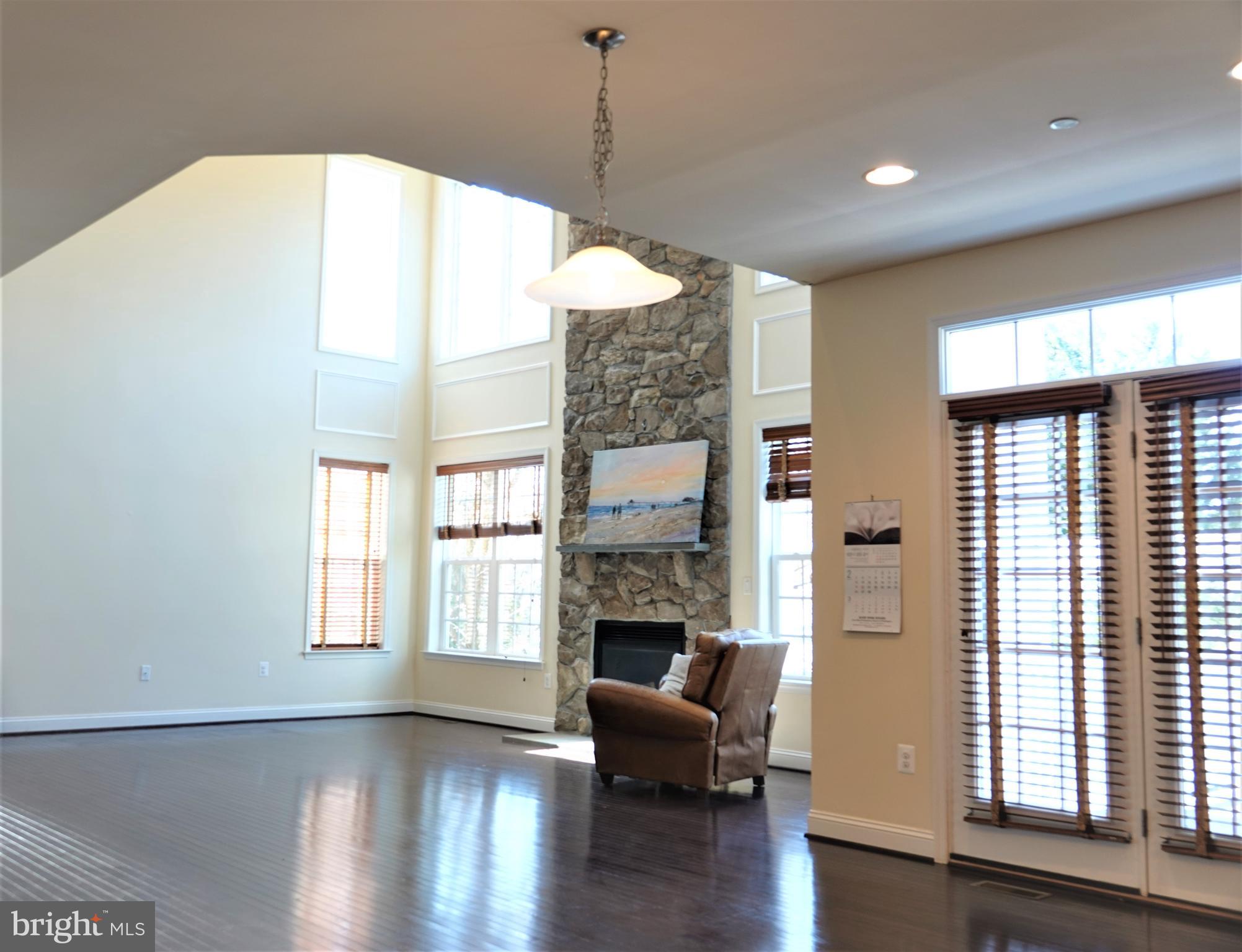 6606 Pyle Road Bethesda, MD 20817 - Photo 14 of 29 a living room with furniture and a fireplace
