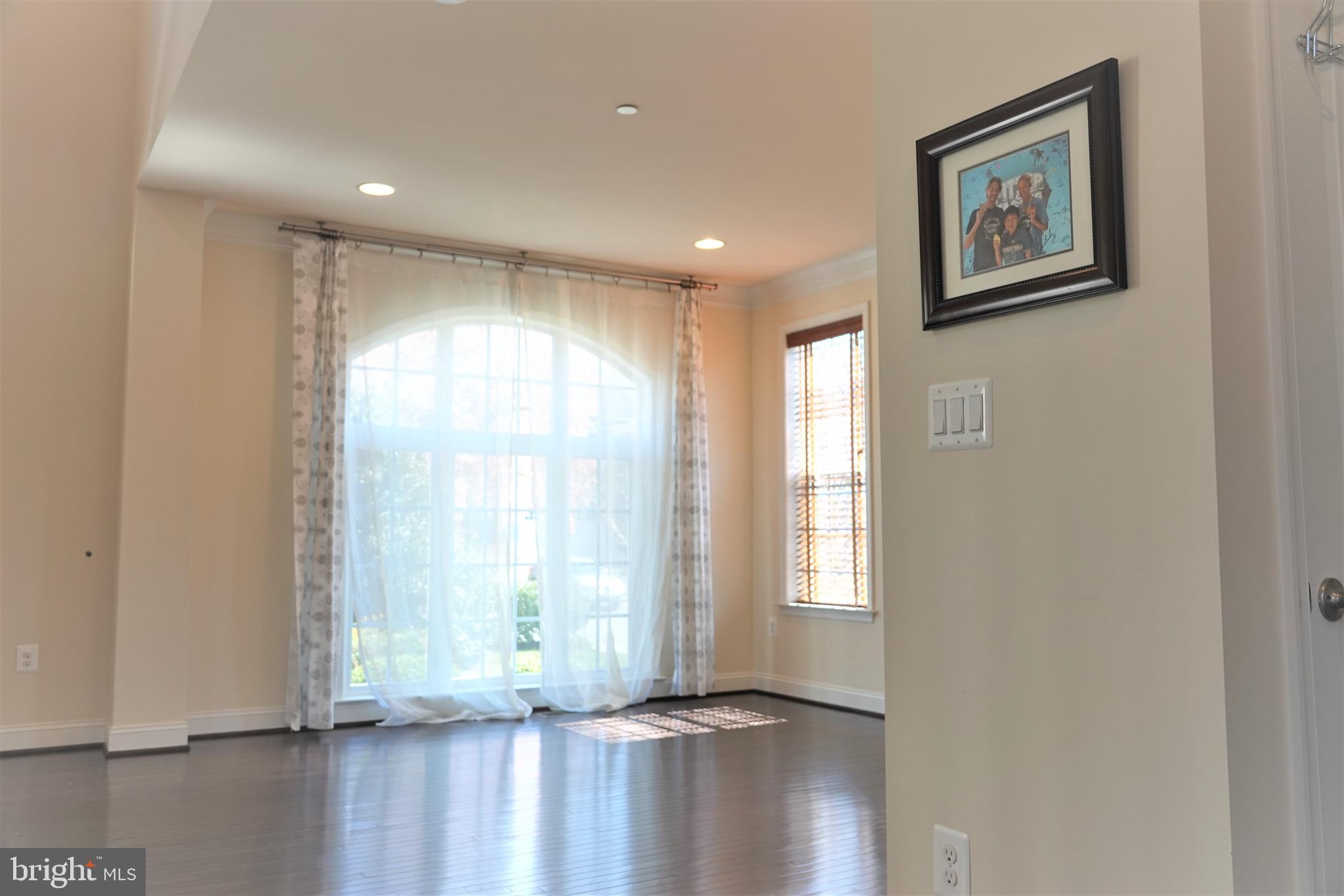 6606 Pyle Road Bethesda, MD 20817 - Photo 4 of 29 a view of a room with wooden floor and window