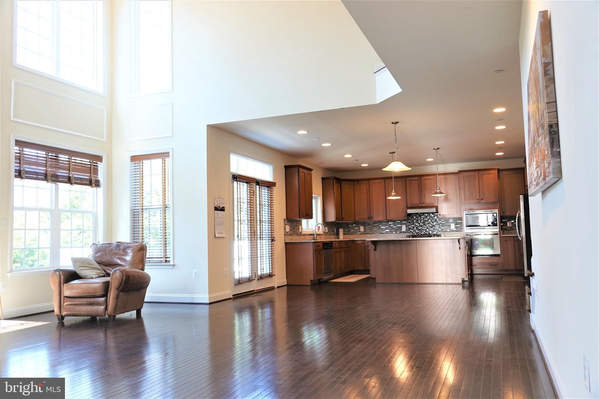 6606 Pyle Road Bethesda, MD 20817 - Photo 6 of 29 a open kitchen with stainless steel appliances kitchen island granite countertop lots of counter top space and furniture