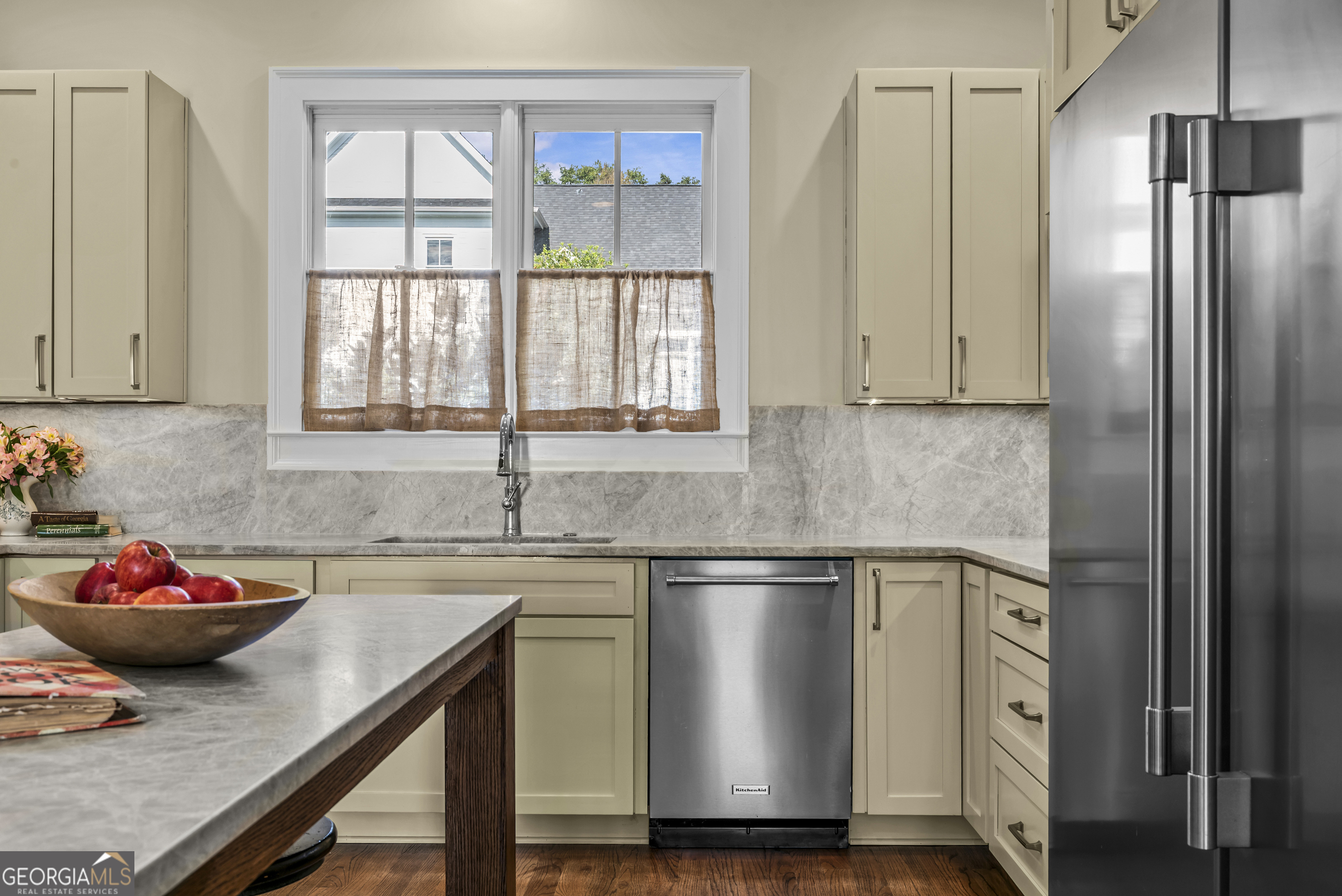 568 New Post Road Madison, GA 30650 - Photo 14 of 58 a kitchen with stainless steel appliances granite countertop a sink and a refrigerator