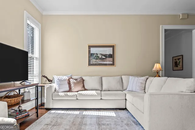 a porch with a bench next to a yard