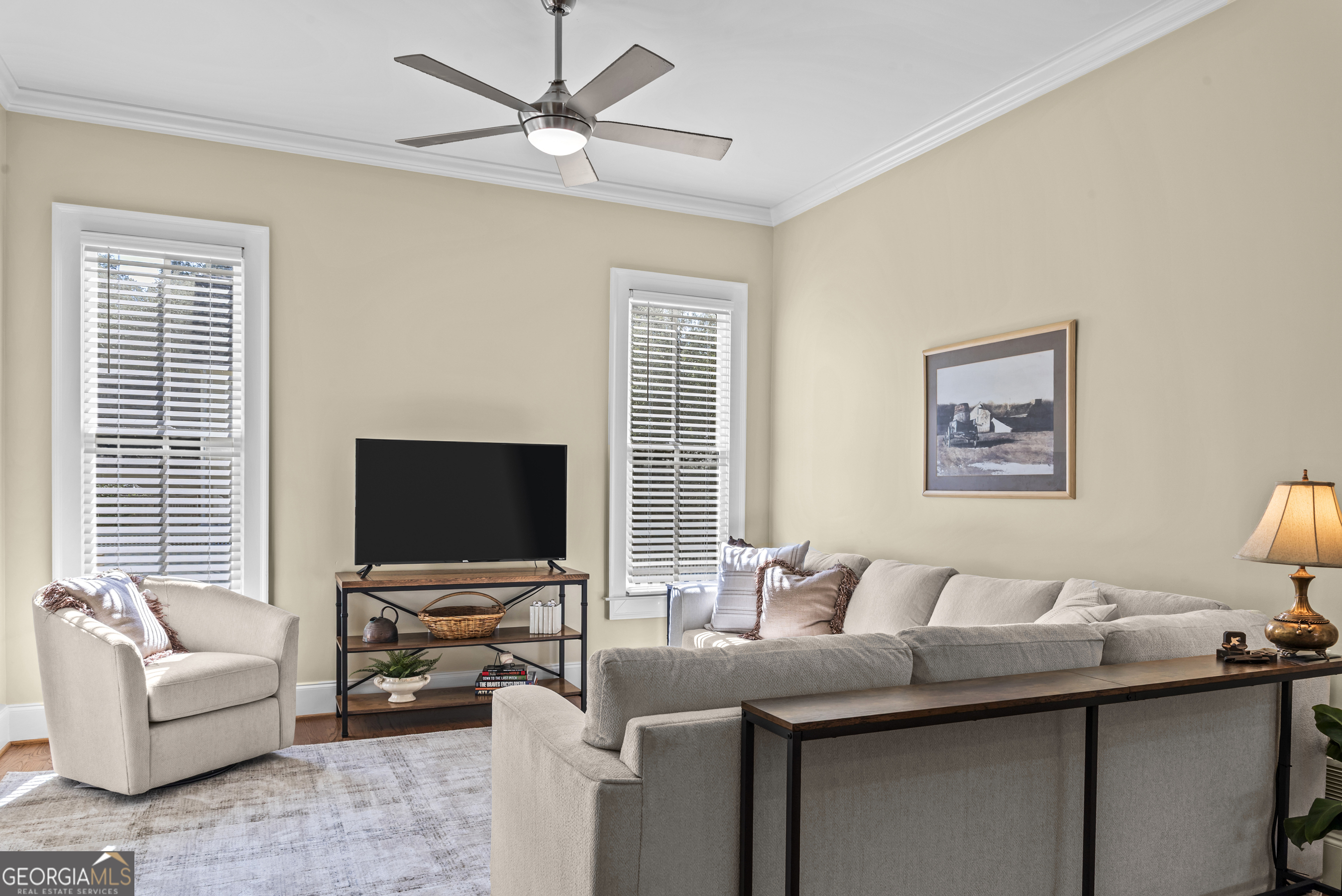 568 New Post Road Madison, GA 30650 - Photo 19 of 58 a living room with furniture and a flat screen tv