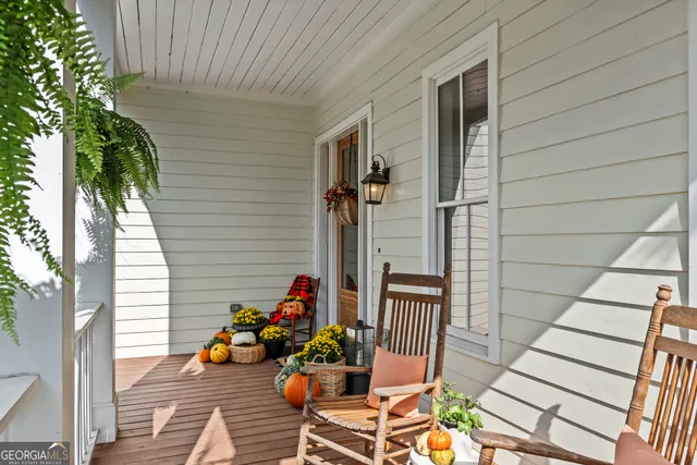 a view of a chairs and table in a balcony