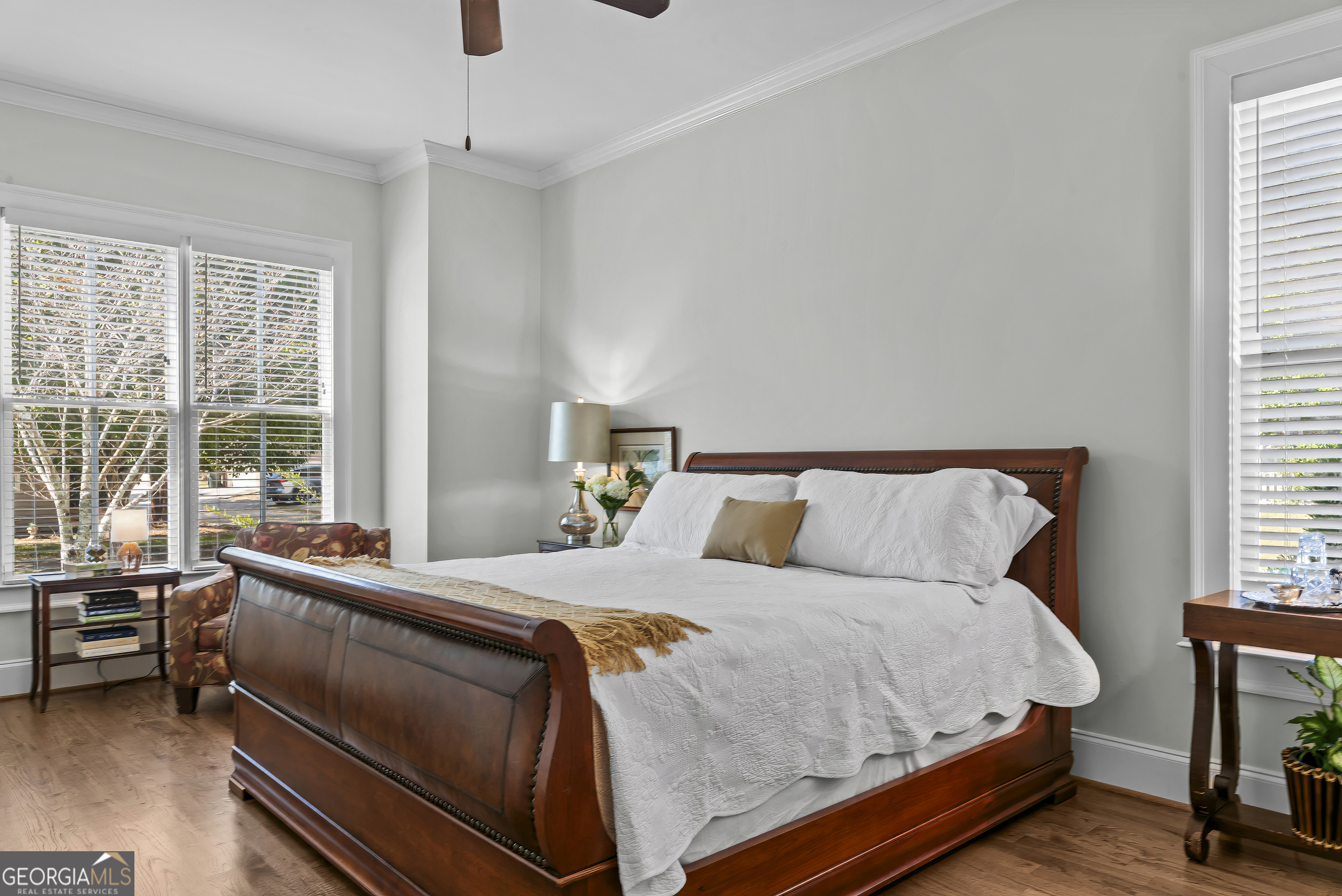 568 New Post Road Madison, GA 30650 - Photo 24 of 58 a bed room with a bed and a chair