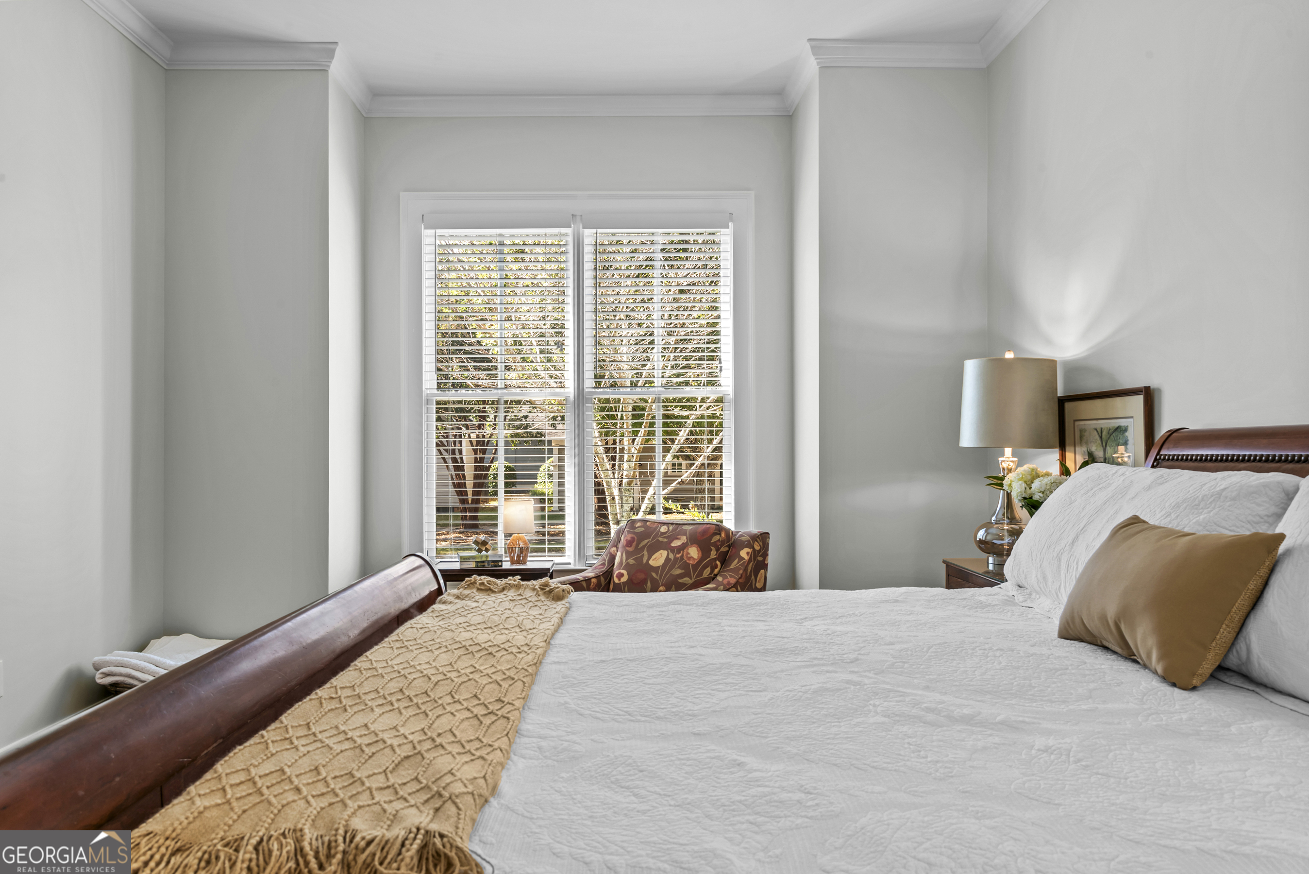 568 New Post Road Madison, GA 30650 - Photo 25 of 58 a bedroom with a bed and a window