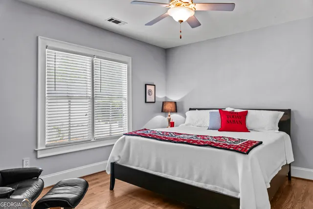 a bedroom with a bed and a window