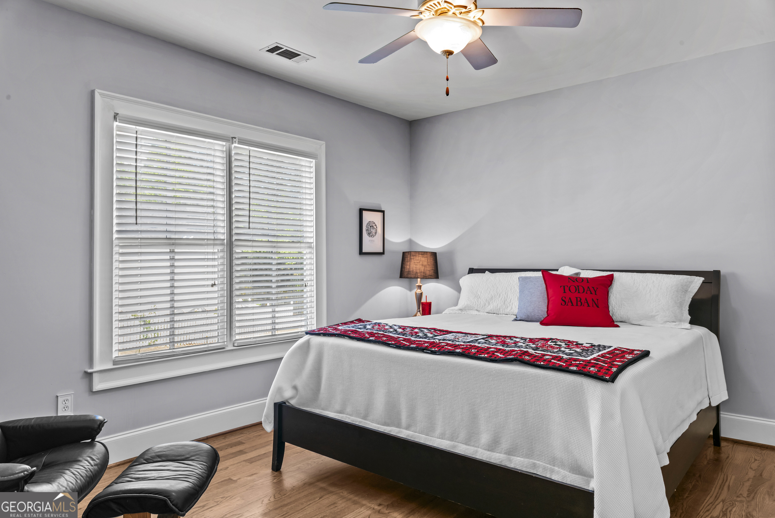 568 New Post Road Madison, GA 30650 - Photo 29 of 58 a bedroom with bed and a window