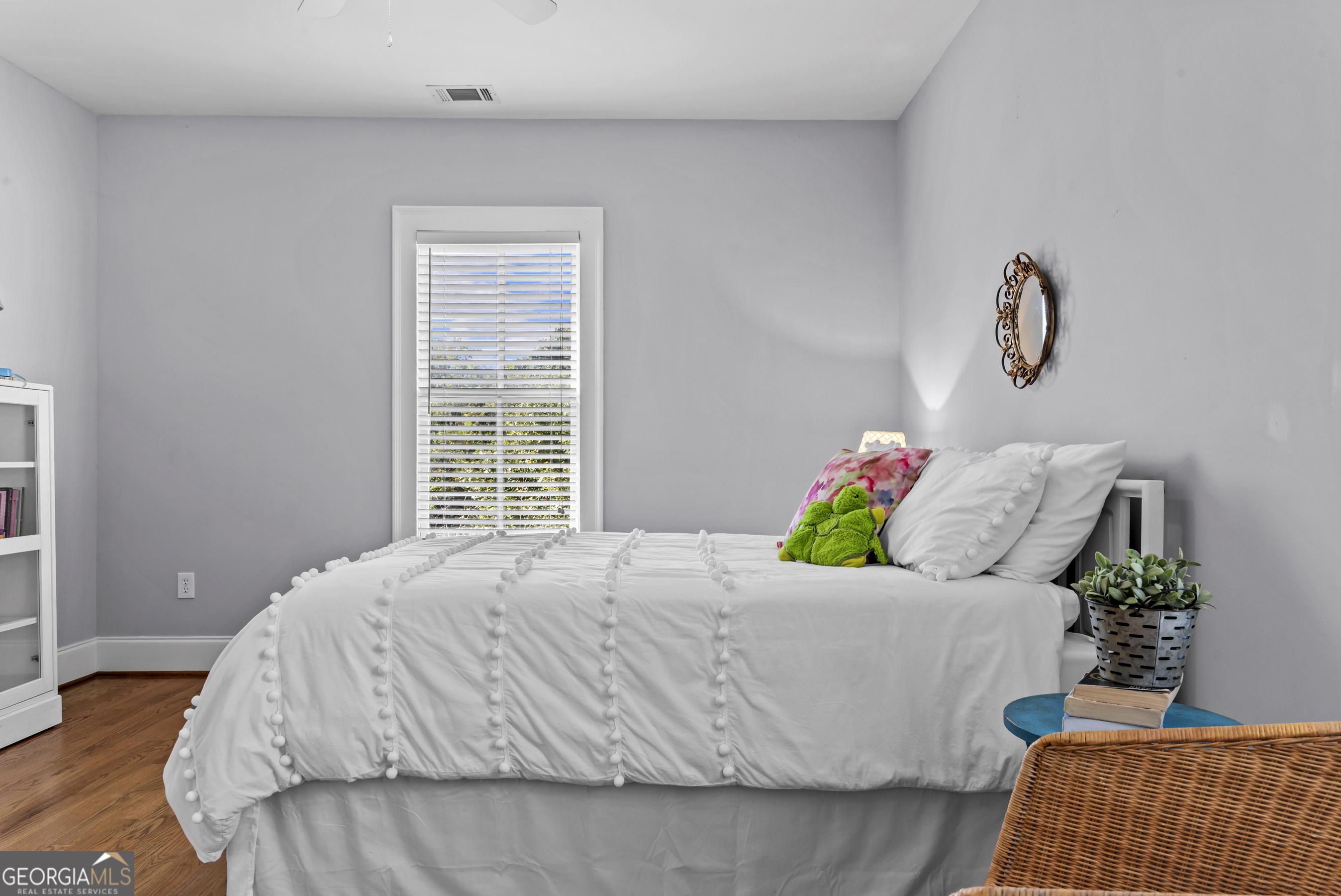 568 New Post Road Madison, GA 30650 - Photo 34 of 58 a bedroom with a bed and window