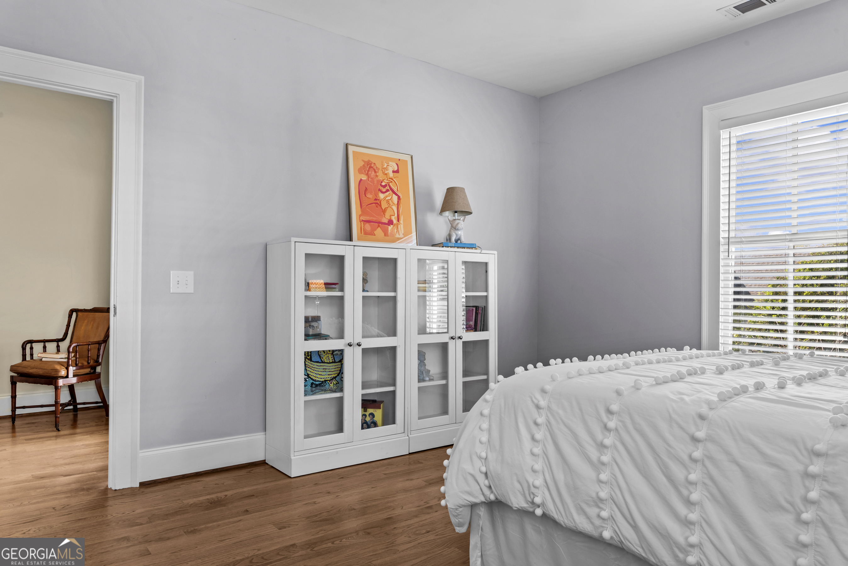 568 New Post Road Madison, GA 30650 - Photo 35 of 58 a bedroom with a bed and a window